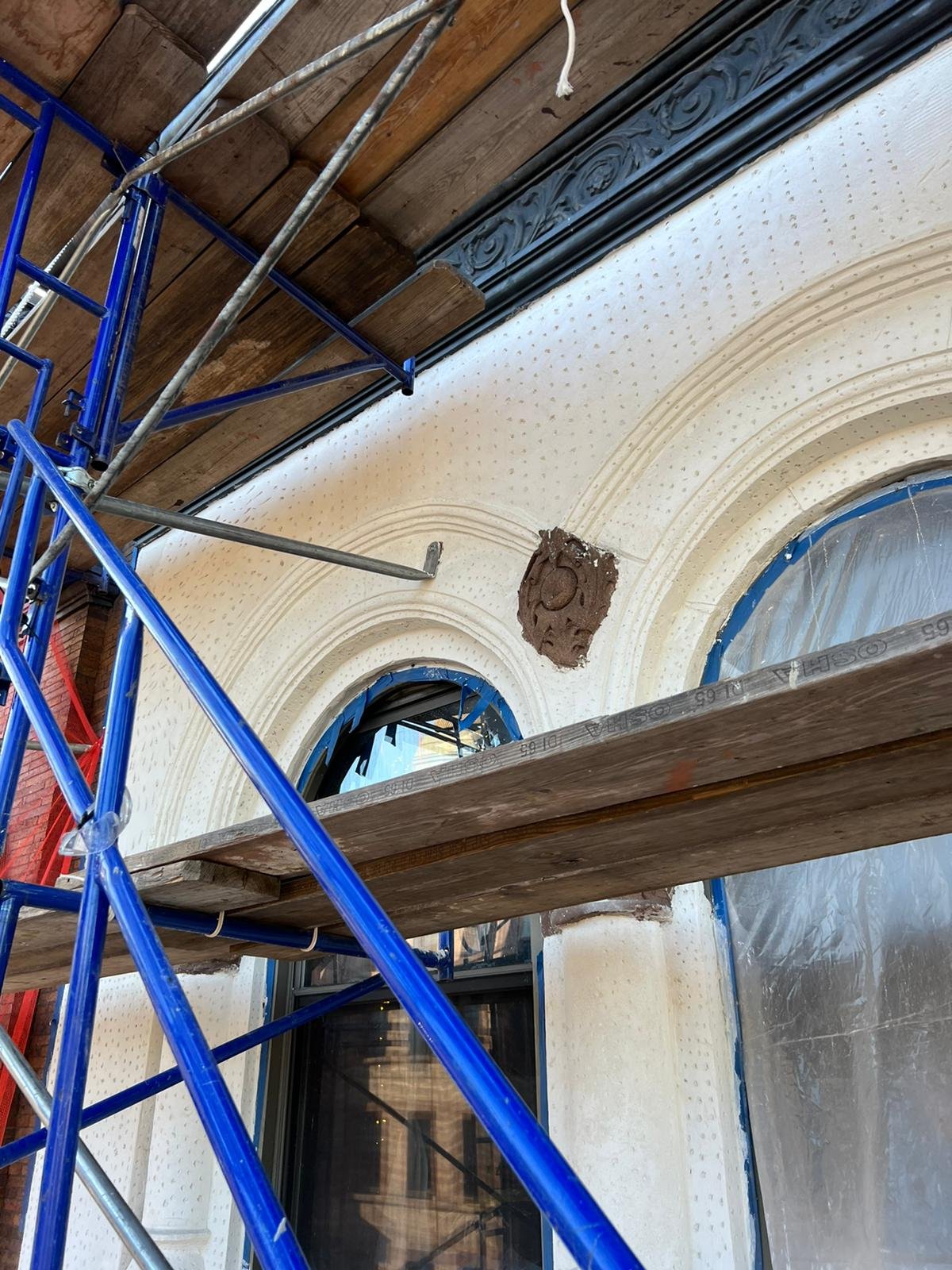 PHOTO-2022-11-03-09-48-54 2 Masons repointing Flemish‑bond brickwork.